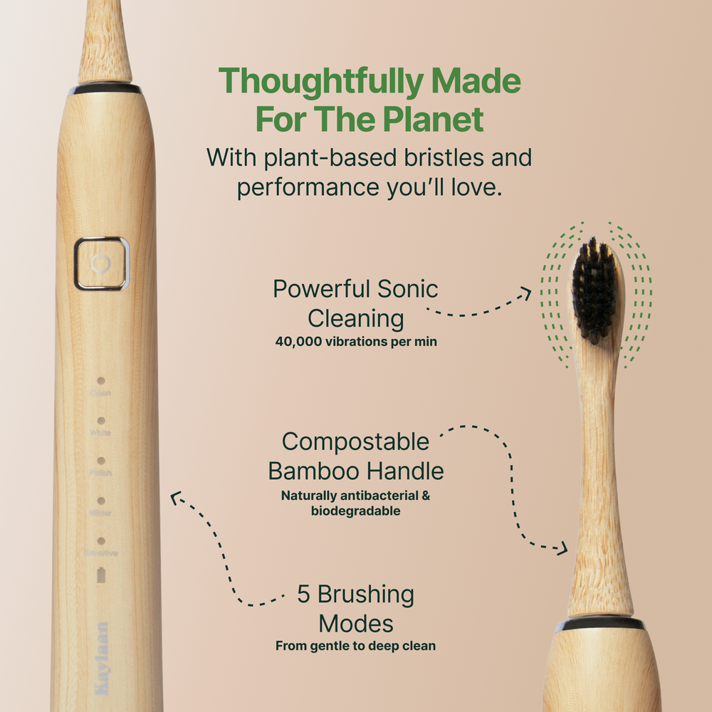 Bamboo toothbrush with text highlighting features on a beige background