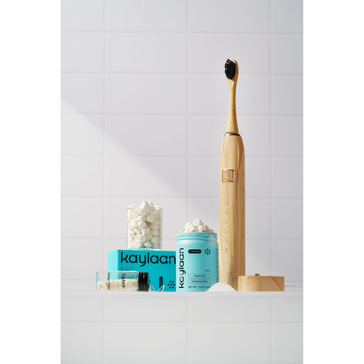 Kaylaan Organic Mint complete oral care bundle with bamboo sonic electric toothbrush, fluoride toothpaste tablets, mouthwash tablets, and dental floss