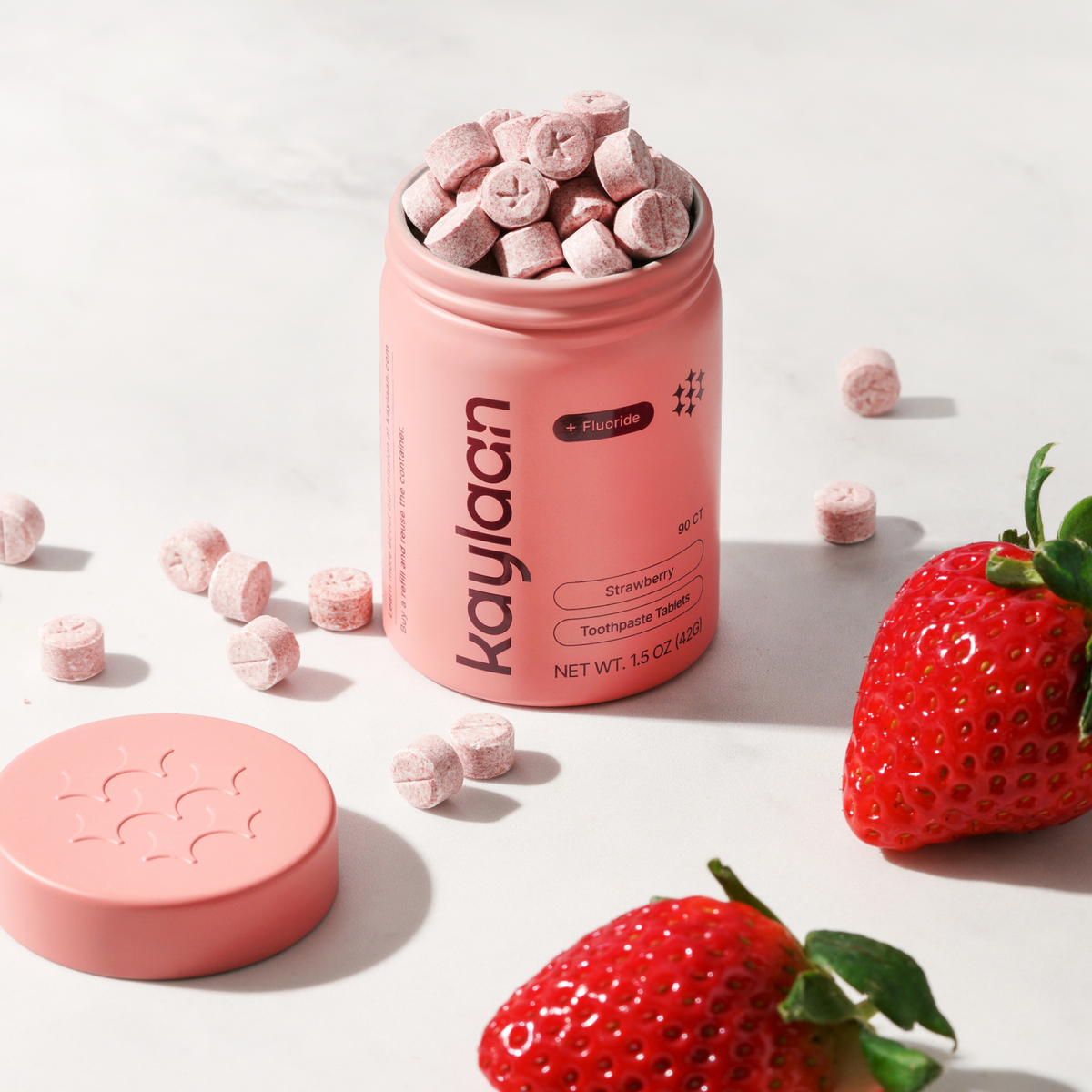 Kaylaan natural strawberry toothpaste tablets with fluoride in plastic free zero waste pink tin